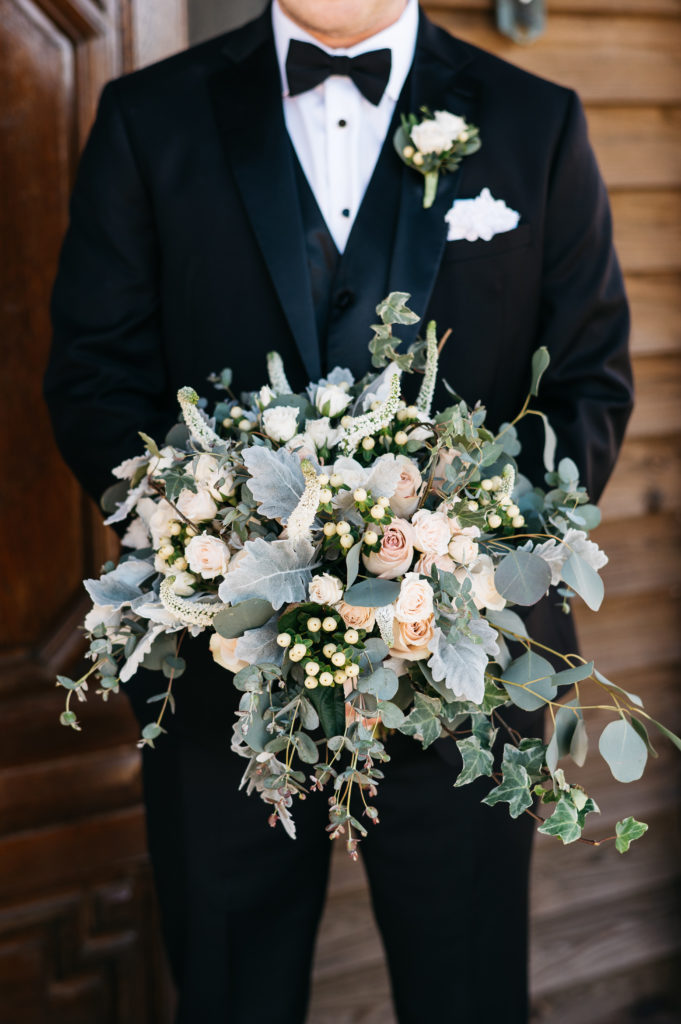 groom holding bouquet - aiken, sc wedding photographer - floral design by flowers on broad - venue pine knoll farms appling, ga 