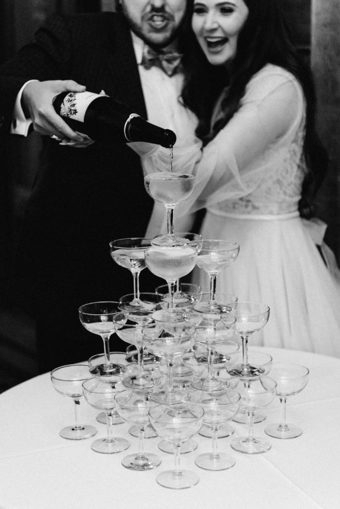 Pouring champagne tower during reception at New Bridge Polo Wedding Photographer Aiken SC